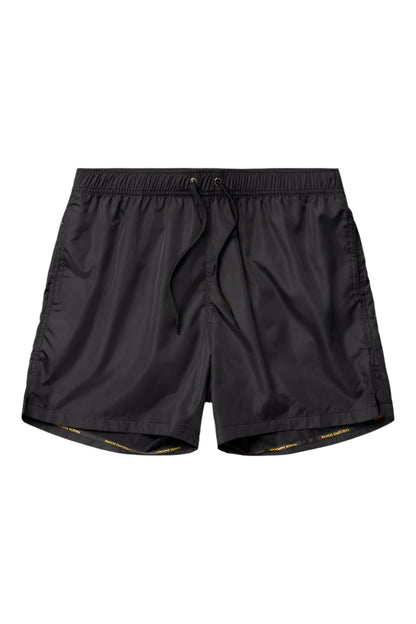Black swim shorts on a light gray background